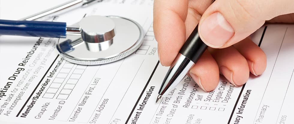 Medical form and stethoscope representing employer screening assessments